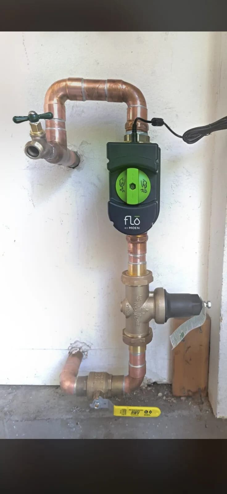 Flo by Moen smart water shutoff with pressure-reducing valve on copper main piping