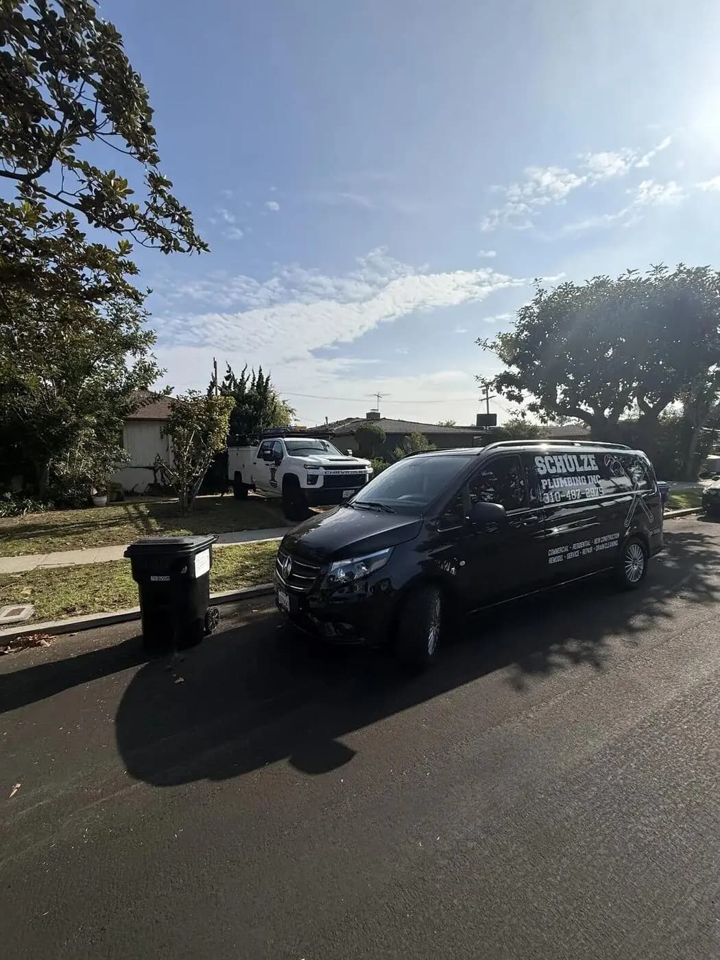 Black Schulze Plumbing Inc. service van lettered for commercial, residential, and drain cleaning